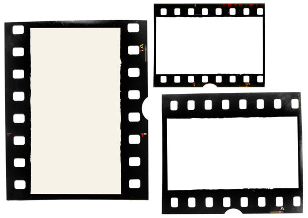 set of grungy looking 35mm filmstrips on white background, real film material real 35mm film material on white background 35mm movie camera stock pictures, royalty-free photos & images