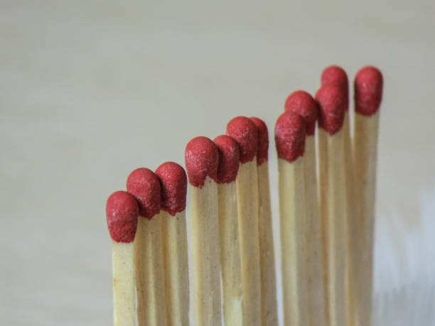 row In this photo the matches are arranged in a diagonal row. inflamable stock pictures, royalty-free photos & images