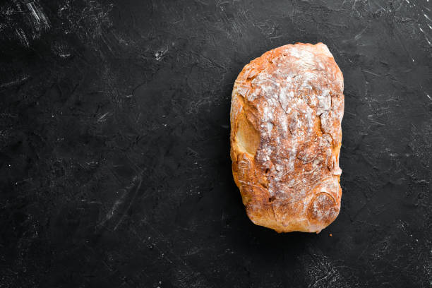 istock Chiabatta Fresh bread. Top view. Free space for your text. 1129941740