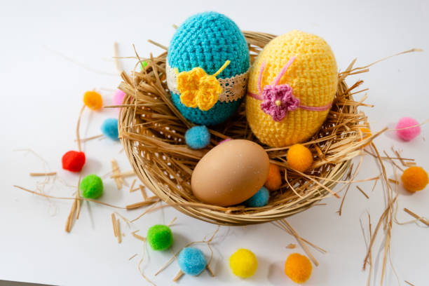 istock Easter eggs in the basket of wooden boards. selective focus. 1129946484