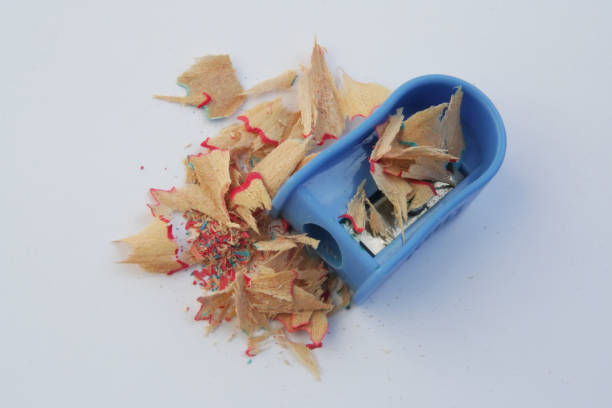 istock Pencil sharpener and sawdust. Dirty pencil sharpener. Pencil sharpener filled with sawdust. 1129954369