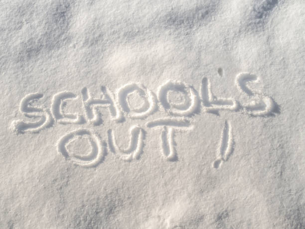 istock Schools out! written in the freshly fallen snow. 1129957726