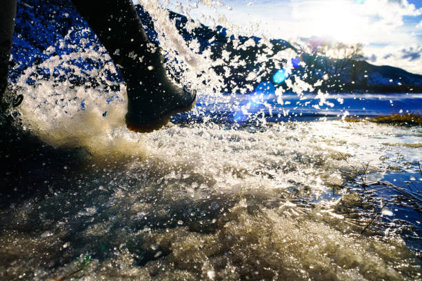 istock Leg Kicking Snow and Ice Action at Sunset 1129976228