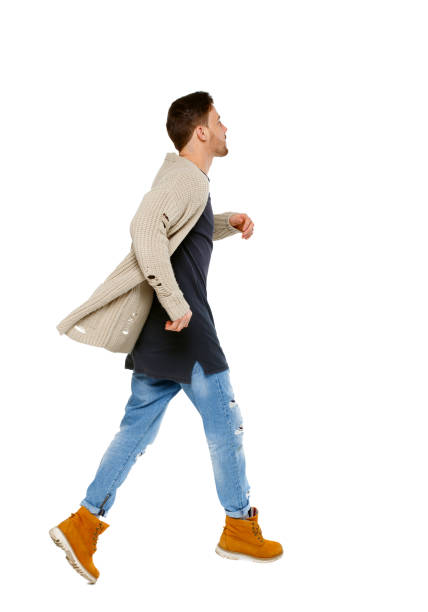 istock Side view of a running man in sweater. 1129985884