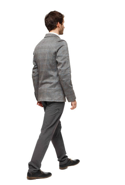 istock back view of walking business man. 1129986641