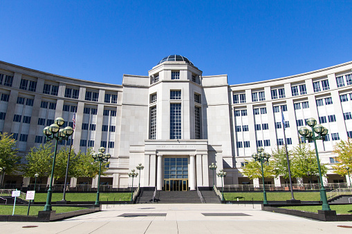 Lansing, Michigan, USA - September 17, 2018: Exterior of the Michigan Hall of Justice building in downtown Lansing. The building home to the Michigan Supreme Court.