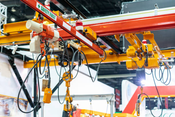 istock Overhead electric chain hoist with hook and remote switch control 1130004502