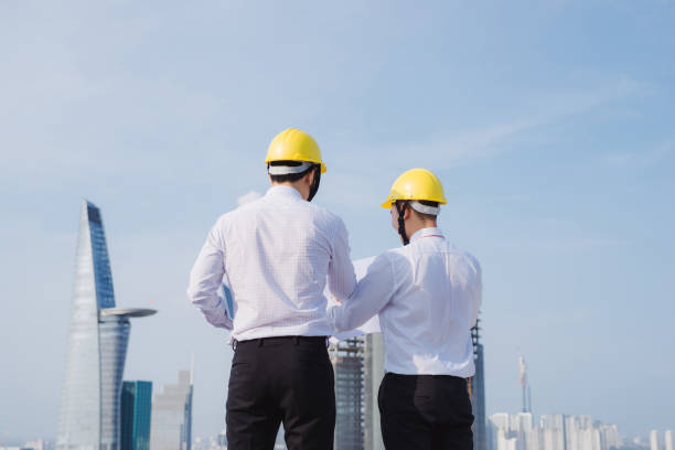 istock View of Two workers working outside with a tablet on a construction site 1130018704