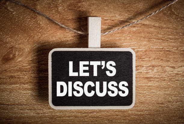 istock Conceptual Chalkboard Showing Let Us Discuss 1130019759