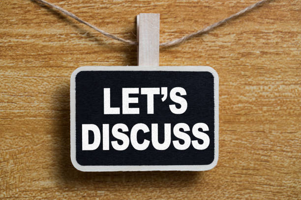 istock Conceptual Chalkboard Showing Let Us Discuss 1130019765