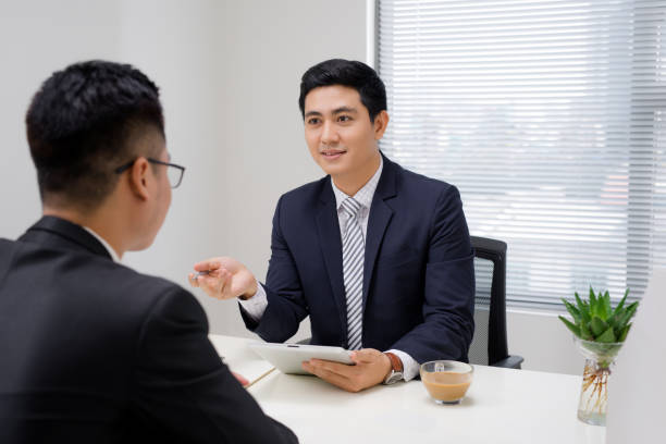 istock Salesman explaining his idea of overcoming crisis to co-worker 1130022977
