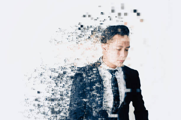 istock young businessman with dispersing and disintegrating into particles effect over white background 1130026942