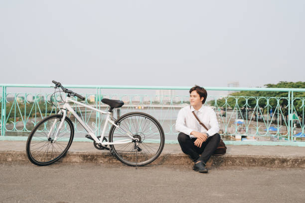 istock Successful handsome asia man riding bicycle 1130026970