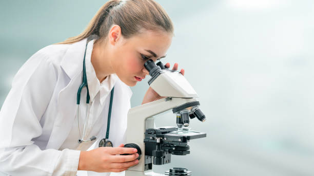 istock Scientist researcher using microscope in laboratory. Medical healthcare technology and pharmaceutical research and development concept. 1130027631