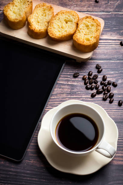 istock Cup of coffee with garlic bread 1130029778