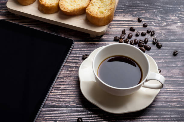 istock Cup of coffee with garlic bread 1130029781