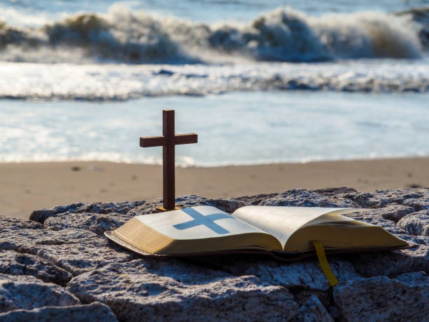 istock Wood cross on stand with holy bible 1130030519