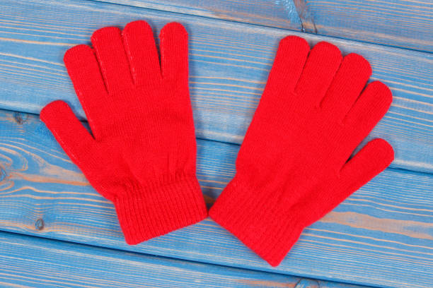 pair of red womanly gloves for autumn or winter - womanly imagens e fotografias de stock