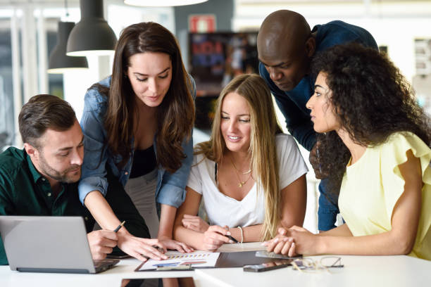 istock Multi-ethnic group of young men and women studying indoors. 1130036851