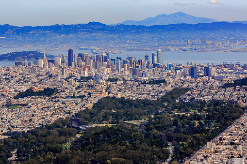 Aerial view of downtown San Francisco and Financial District sky scrapers flying over  Golden Gate circa 2015