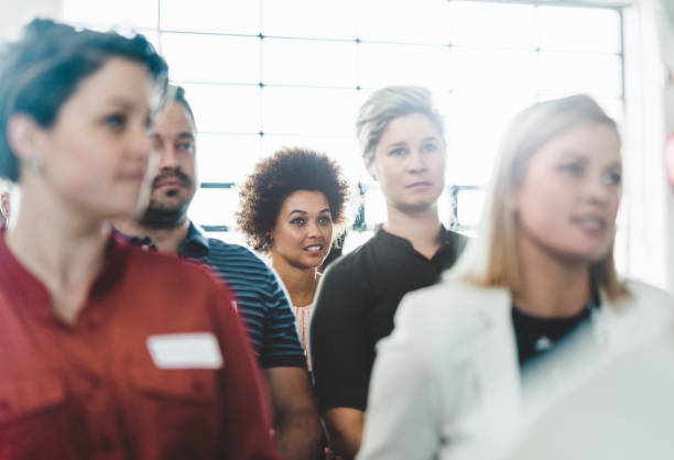 istock Dedicated business professionals attending seminar 1130040024