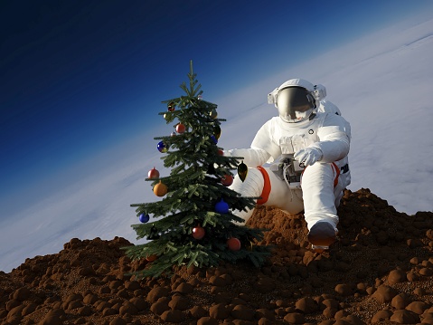 Astronaut dress up a Christmas tree. , 3d render