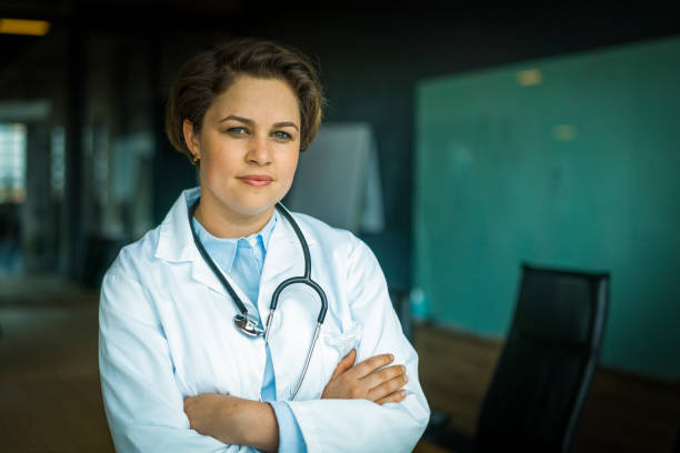 istock Confident female doctor standing in board room 1130040685