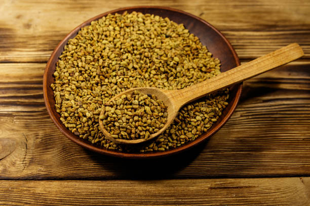 istock Fenugreek seeds in ceramic plate on wooden table 1130040738