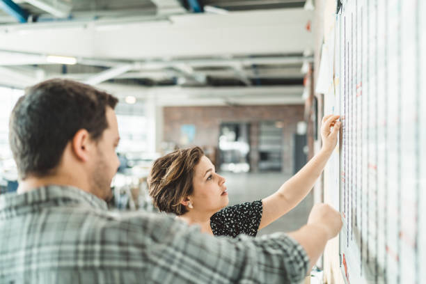 istock Business people analyzing new strategy on whiteboard 1130040831