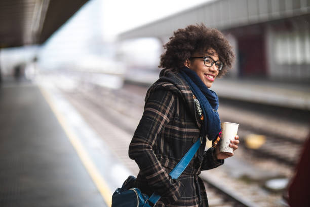 Commuter on train station Young woman waiting for the train rush hour stock pictures, royalty-free photos & images