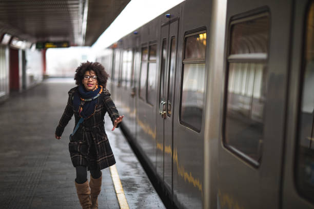 istock Woman running to catch the train 1130044997