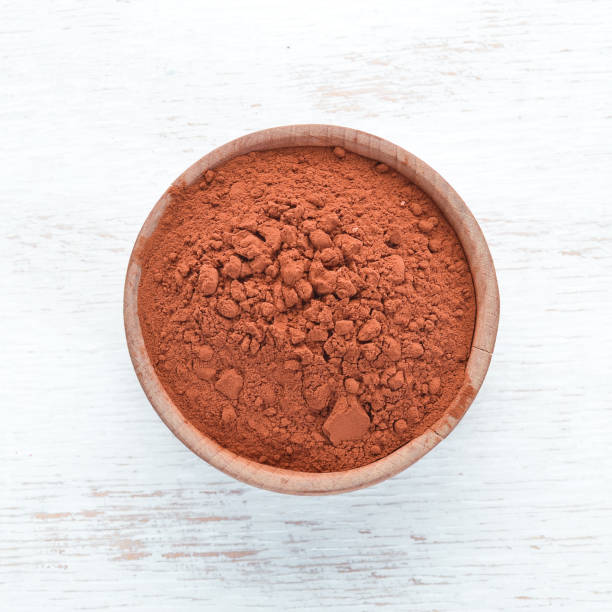 istock Cocoa powder in a bowl. On a white background. Top view. Free copy space. 1130047042