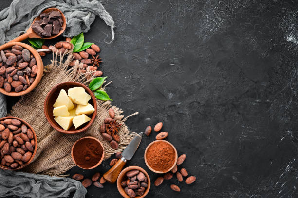 istock Chocolate, cocoa beans, cocoa butter. Chocolate Background Top view. Free copy space. 1130047839