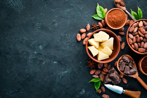 istock Chocolate, cocoa beans, cocoa butter. Chocolate Background Top view. Free copy space. 1130047858