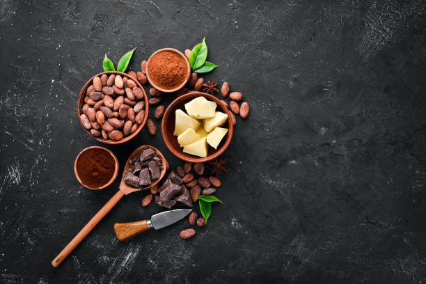 istock Chocolate, cocoa beans, cocoa butter. Chocolate Background Top view. Free copy space. 1130047896