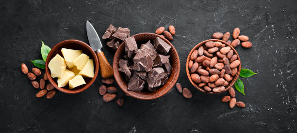 istock Chocolate, cocoa beans, cocoa butter. Chocolate Background Top view. Free copy space. 1130047923