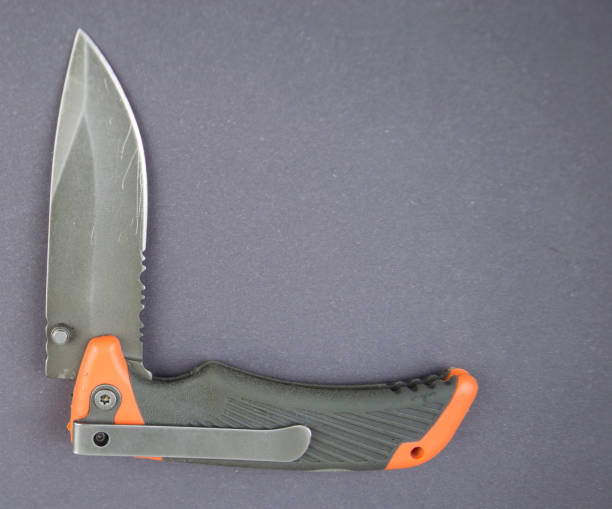 istock folding pocket knife on a gray background with a place to fill 1130049044