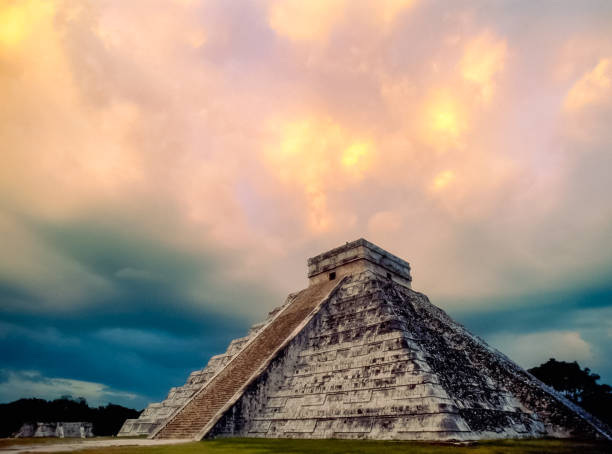 Chichenitza ruins - composition with serpent head and pyramid of Kukulkan during the Spring Equinox