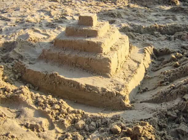 istock Sandy pyramid of sand on the beach. 1130049325