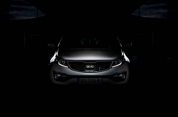 low key photo of suv kia sportage 2.0 crdi awd or 4x4, a dark picture, so that you can only see the contours of the car design. it looks like beast in the cave. - europe bridge editorial eastern europe imagens e fotografias de stock