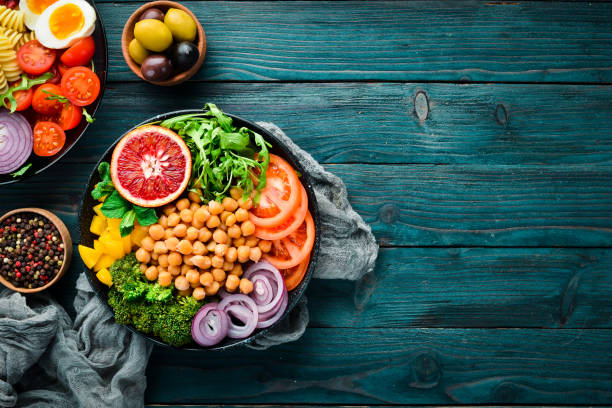 istock Buddha bowl. Turkish peas, broccoli, tomatoes, onions. Top view. Free space for your text. 1130049446