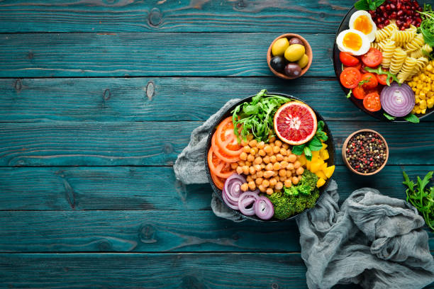 istock Buddha bowl. Turkish peas, broccoli, tomatoes, onions. Top view. Free space for your text. 1130049480