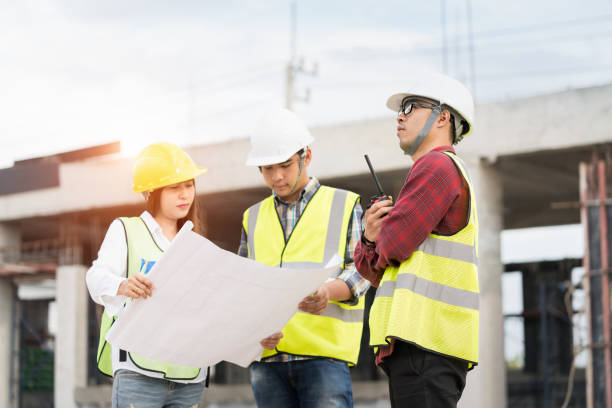istock Architect and engineer meeting planning for a new project with construction equipment at construction site 1130050150
