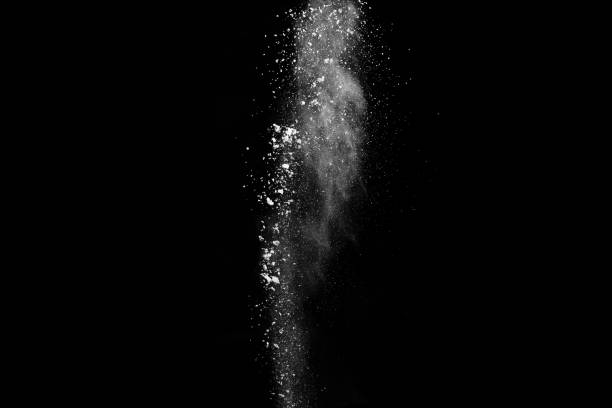 White powder explosion on black background. Colored cloud. Colorful dust explode. Paint Holi.