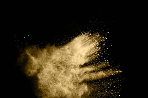 istock Golden powder explosion on black background. Freeze motion. 1130052919