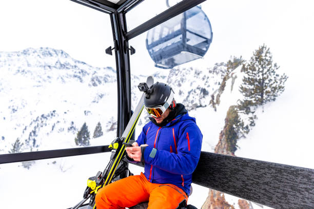 istock Skier typing on his phone 1130053586