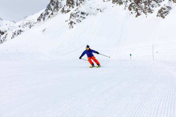 istock Man skiing on the ski slopes 1130053592