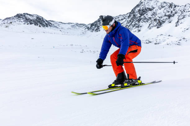 istock Man skiing on the ski slopes 1130053595