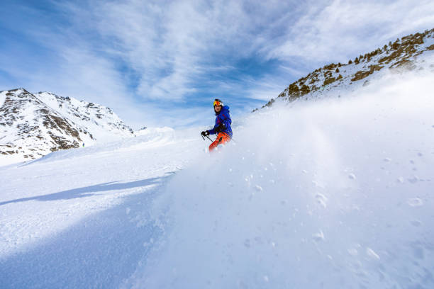 istock Man skiing on the ski slopes 1130053613