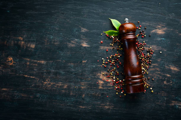 istock Mill pepper and pepper. Spices Top view. On the old background. 1130055017